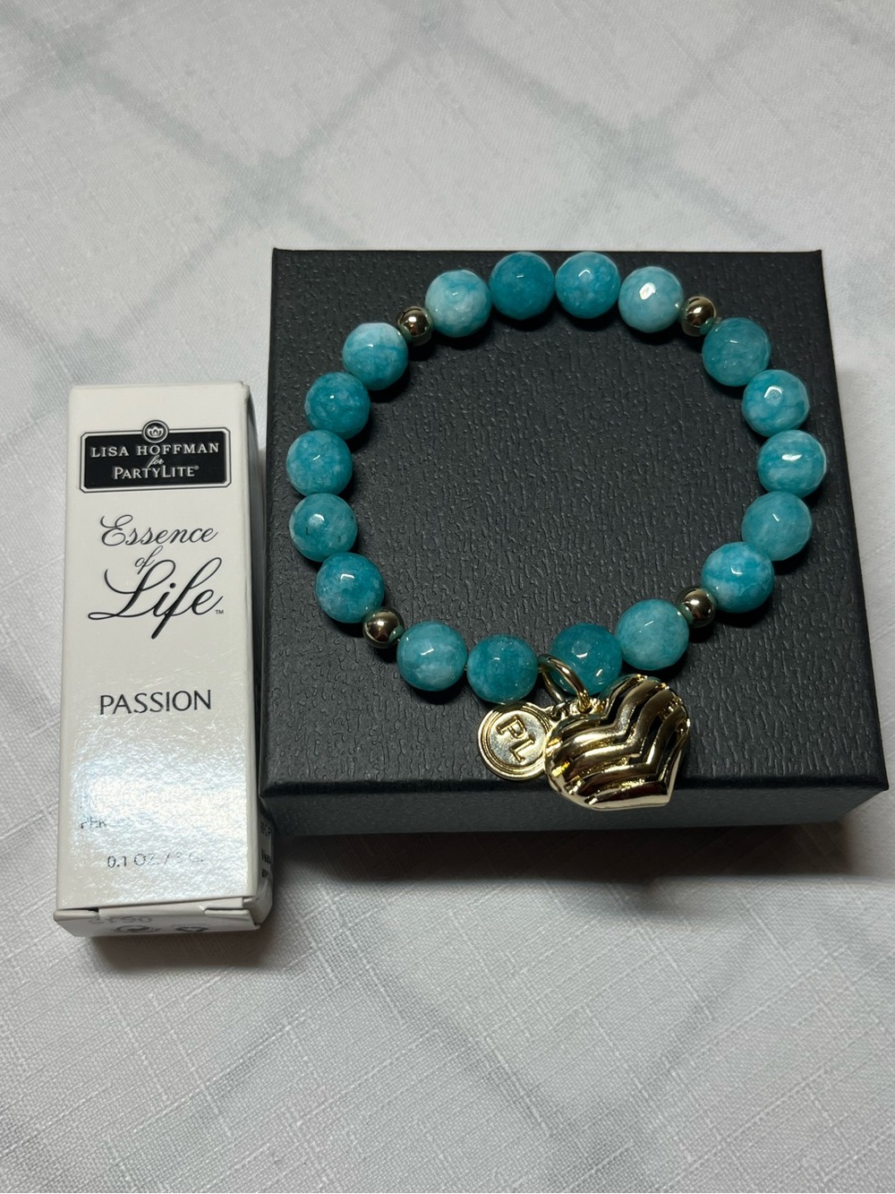 PartyLite Essence of Life Bracelet Blue
Silver Heart Charm
Passion Scent Beads